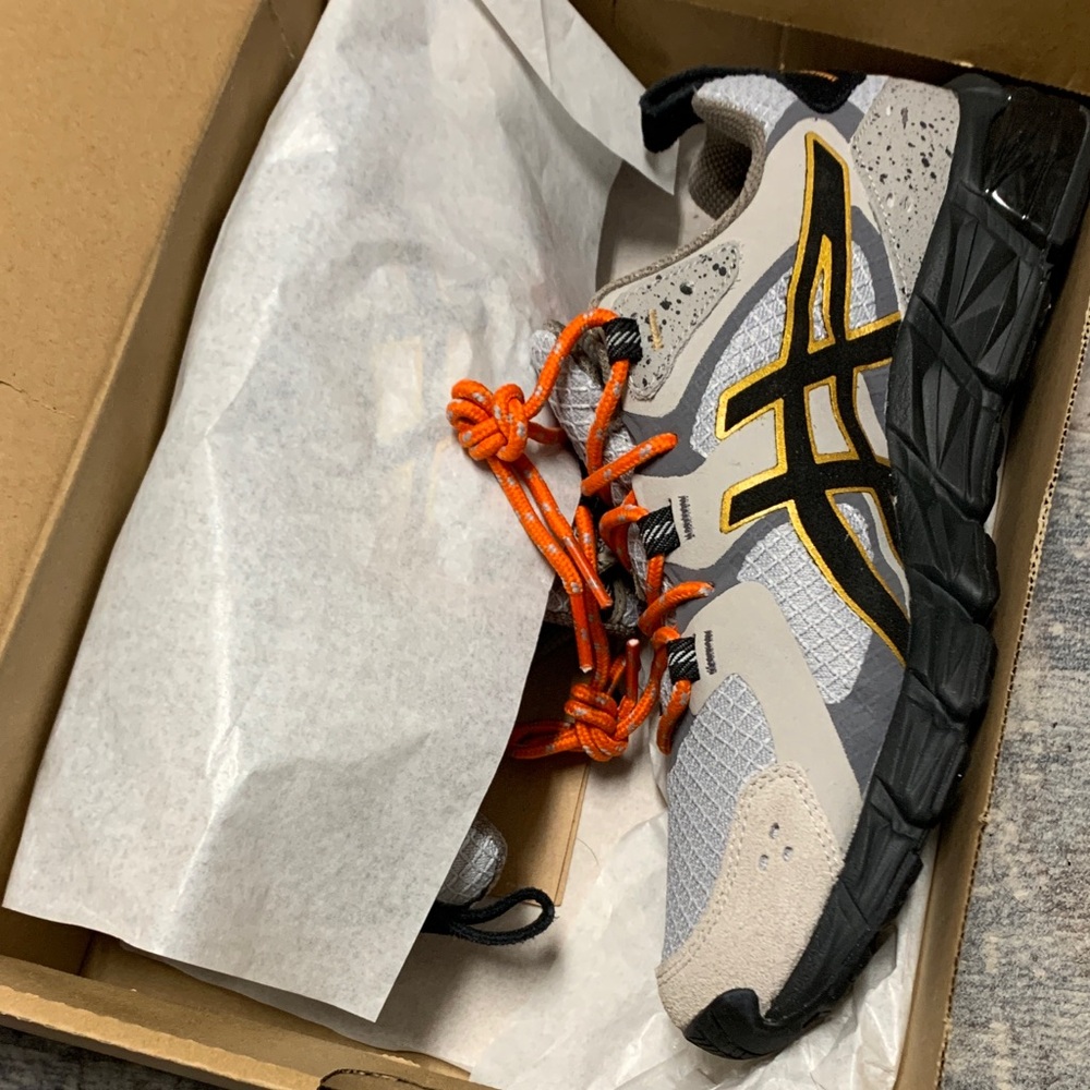 Asics Black and Gray Running Shoes with Vibrant Orange Laces